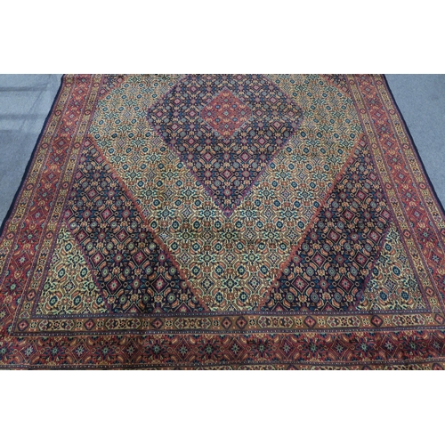 126 - A MULTICOLOURED GROUND TABRIZ RUG with red diamond central medallion and matching borders 289cm long... 