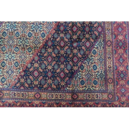 126 - A MULTICOLOURED GROUND TABRIZ RUG with red diamond central medallion and matching borders 289cm long... 