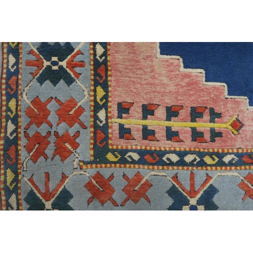 127 - A PINK & BLUE GROUND TURKISH KAYAM RUG with floral geometric central medallion and multicoloured... 