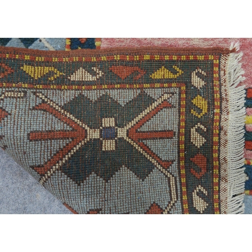 127 - A PINK & BLUE GROUND TURKISH KAYAM RUG with floral geometric central medallion and multicoloured... 