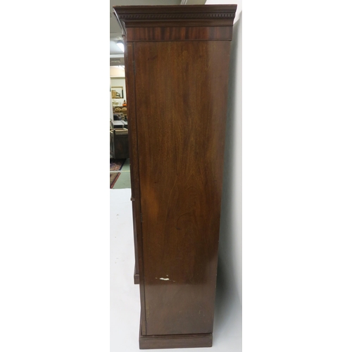17 - A 19TH CENTURY MAHOGANY CROSSBANDED COMPACTUM the dentil cornice above a central pair of doors, two ... 
