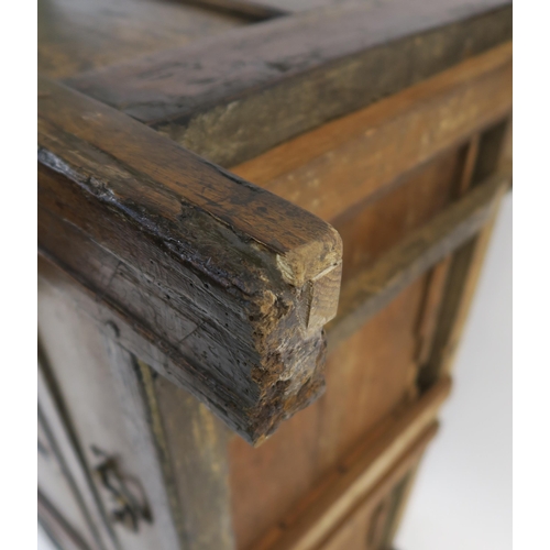 2 - AN 18TH CENTURY OAK COFFER the hinged lid above a carved foliate frieze divided by I.P monogram, wit... 