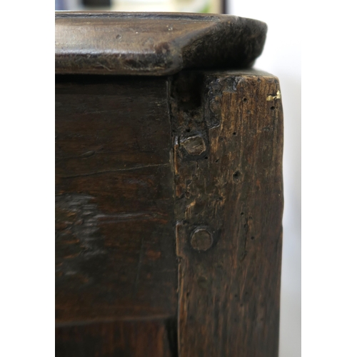 2 - AN 18TH CENTURY OAK COFFER the hinged lid above a carved foliate frieze divided by I.P monogram, wit... 