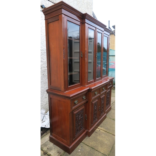 20 - A LATE VICTORIAN MAHOGANY BREAKFRONT DISPLAY CABINET with four glazed doors enclosing shelves with m... 