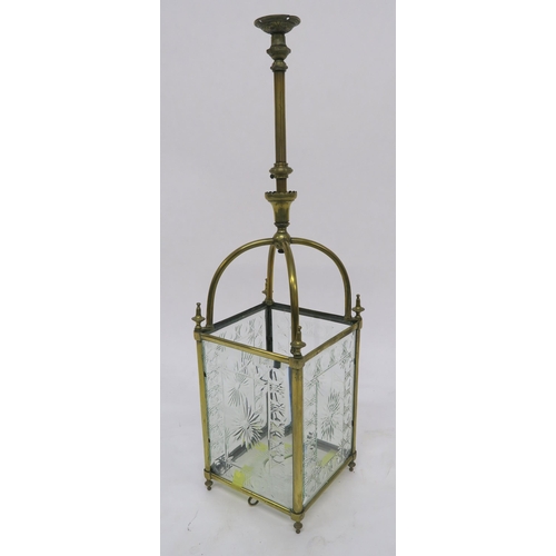 3 - AN EDWARDIAN BRASS AND CUT GLASS HALL LANTERN set with four foliate cut panels and base, 90cm high, ... 