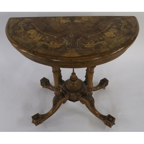 31 - A VICTORIAN BURR WALNUT AND MARQUETRY INLAID DEMI LUNE FOLD OVER CARD TABLE on turned supports above... 