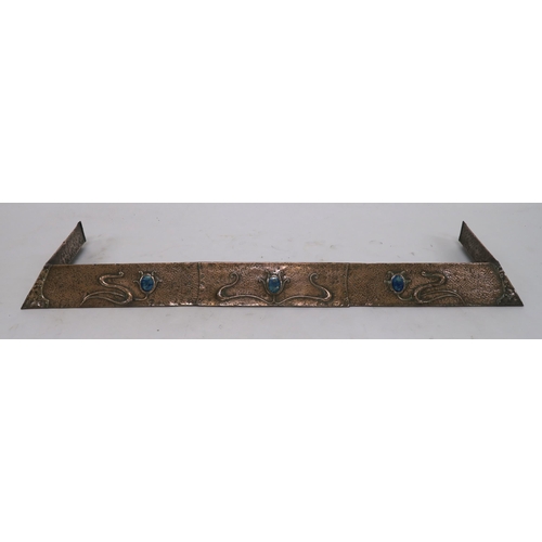 4 - AN ARTS AND CRAFTS HAMMERED COPPER FENDER with sinous foliage and inset with ceramic medallions, 12c... 