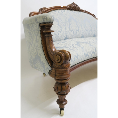 42 - A VICTORIAN MAHOGANY FRAMED SOFA,upholstered in a light blue damask fabric on turned supports, 102cm... 