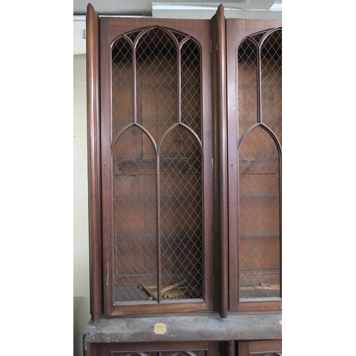 49 - A LARGE VICTORIAN MAHOGANY GOTHIC REVIVAL BOOKCASE,with seven pierced grill doors above seven styliz... 