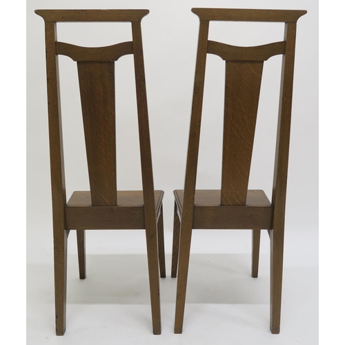 52 - A PAIR OF ARTS AND CRAFTS HALL CHAIRS,each with mother of pearl and fruitwood inlay to splats on squ... 