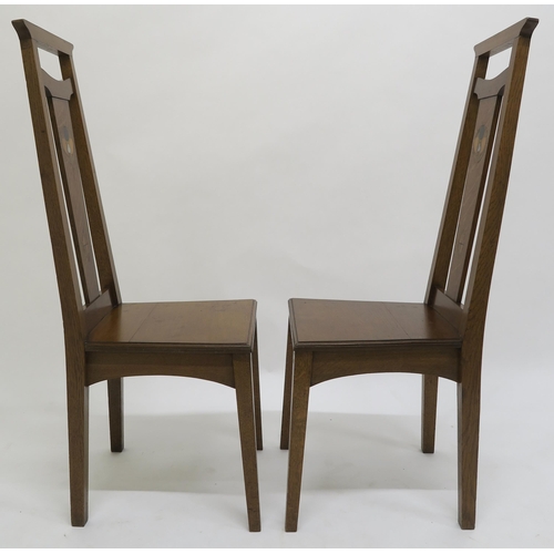 52 - A PAIR OF ARTS AND CRAFTS HALL CHAIRS,each with mother of pearl and fruitwood inlay to splats on squ... 