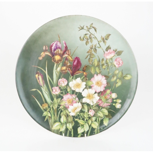 352 - A BROWN WESTHEAD MOORE & CO POTTERY CHARGER painted with irises and dog roses, 37cm diameter, im... 