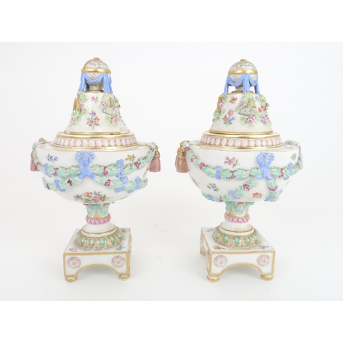 354 - A PAIR OF 19TH CENTURY MEISSEN URNS AND COVERS the finials modelled as globes of the world surrounde... 