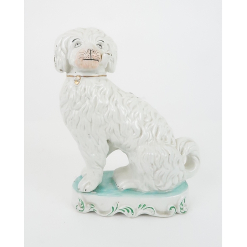 356 - A VICTORIAN STAFFORDSHIRE POTTERY SEATED SPANIEL modelled smoking a pipe, with gilt details to colla... 