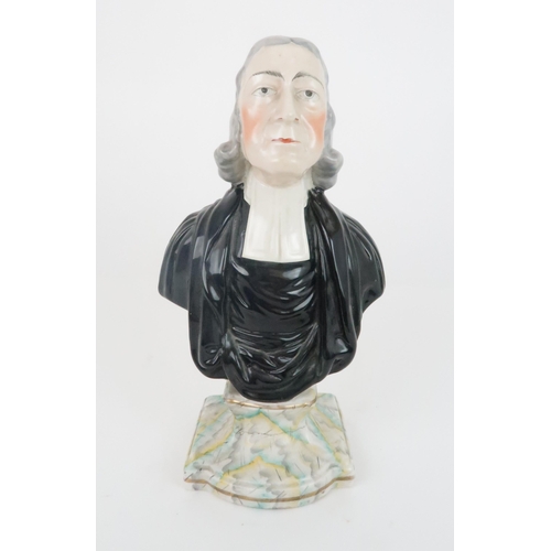 357 - A 19TH CENTURY STAFFORDSHIRE BUST OF REV JOHN WESLEYfounder of the Methodists, upon painted plinth, ... 