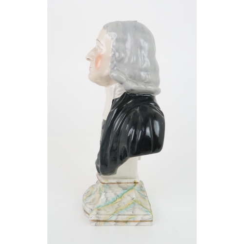 357 - A 19TH CENTURY STAFFORDSHIRE BUST OF REV JOHN WESLEYfounder of the Methodists, upon painted plinth, ... 