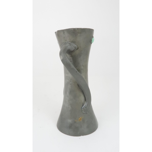 362 - ATTRIBUTED TO OLIVER BAKER FOR LIBERTY & CO, A TUDRIC PEWTER VASE with twisting handles and gree... 