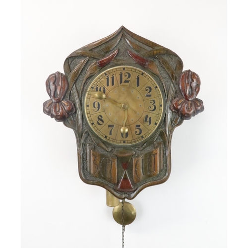 367 - A GERMAN/ AUSTRIAN WALL CLOCK the brass dial with stylised Arabic numerals, the wooden case carved w... 