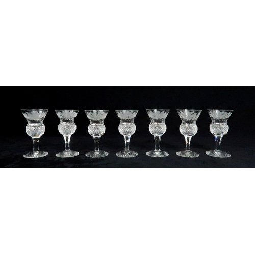 369 - A SUITE OF EDINBURGH THISTLE SHAPED GLASSWARE including seven flute champagne glasses, 17cm high, si... 