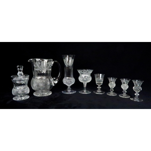 369 - A SUITE OF EDINBURGH THISTLE SHAPED GLASSWARE including seven flute champagne glasses, 17cm high, si... 