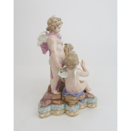 371 - A MEISSEN ALLEGORICAL GROUP DEPICTING SCULPTURE modelled as three putti, one holding a hammer and ch... 