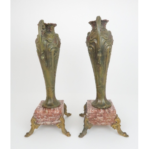 373 - A PAIR OF FRENCH ART NOUVEAU SPELTER VASESeach with a maidens profile and painted green patination, ... 