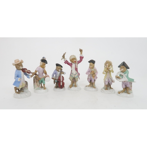 377 - FIVE CONTINENTAL MONKEY BAND FIGURESin the style of Meissen including a bagpipe player, a French hor... 