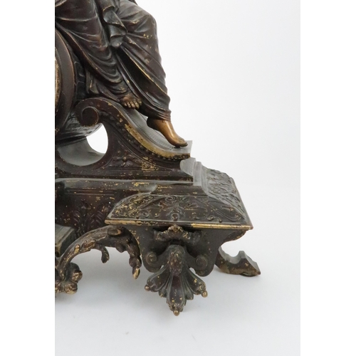 385 - A FRENCH PATINATED SPELTER MANTLE CLOCKmodelled as Diana holding a bow with a dog at her side, the d... 