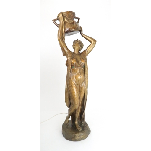 390 - A GOLDSCHEIDER FIGURAL LAMPmodelled as a maiden holding a urn above her head, impressed marks, 84.5c... 