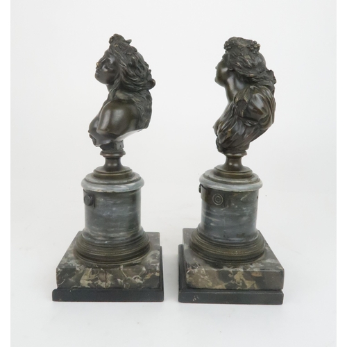 396 - A PAIR OF BRONZE BUSTS OF BUCCANTEmodelled on circular marble plinths and stepped base, 30cm high... 