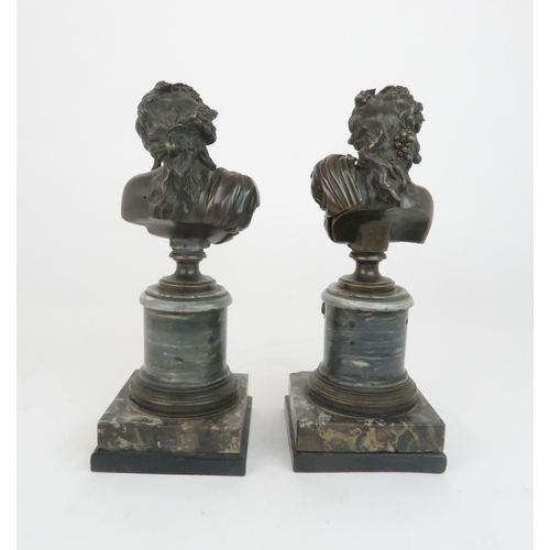 396 - A PAIR OF BRONZE BUSTS OF BUCCANTEmodelled on circular marble plinths and stepped base, 30cm high... 