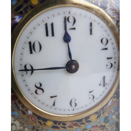 402 - AN EARLY 20TH CENTURY FRENCH BRASS AND CHAMPLEVE ENAMEL CARRIAGE CLOCKthe white dial with arabic num... 