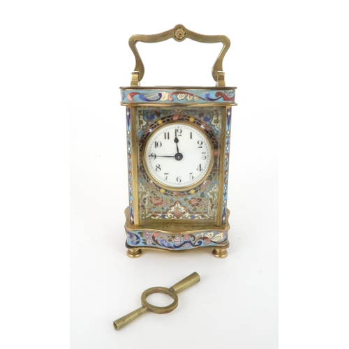 402 - AN EARLY 20TH CENTURY FRENCH BRASS AND CHAMPLEVE ENAMEL CARRIAGE CLOCKthe white dial with arabic num... 