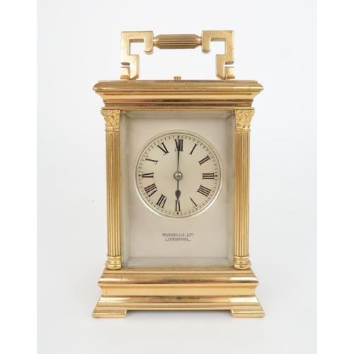 403 - A FRENCH GILT METAL REPEATING CARRIAGE CLOCKwith silvered face and dial with roman numerals, platfor... 