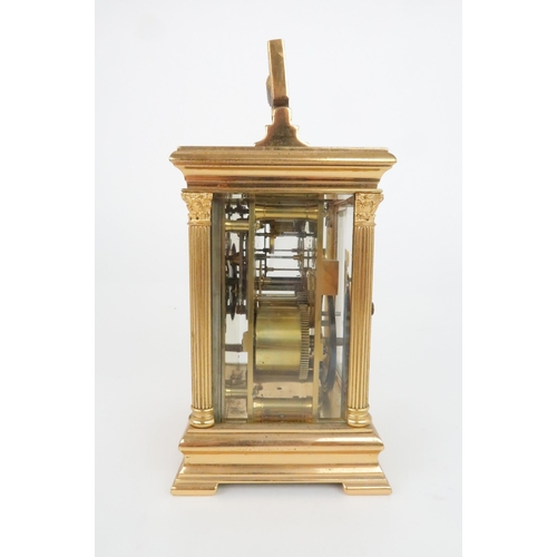 403 - A FRENCH GILT METAL REPEATING CARRIAGE CLOCKwith silvered face and dial with roman numerals, platfor... 