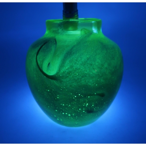 405 - A MONART URANIUM GLASS VASEthe mottled dark blue body with swirling decoration, and clear green rim,... 