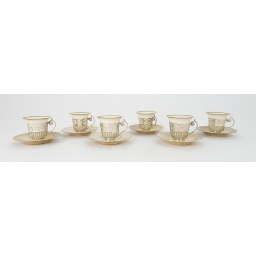 406 - SIX LENNOX PORCELAIN AND SILVER MOUNTED DEMITASSE COFFEE CUPS AND SOLID SILVER SAUCERShallmarked for... 