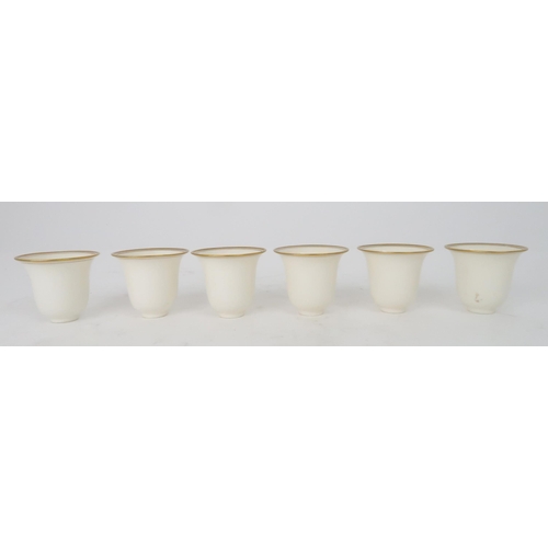 406 - SIX LENNOX PORCELAIN AND SILVER MOUNTED DEMITASSE COFFEE CUPS AND SOLID SILVER SAUCERShallmarked for... 