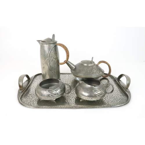 423 - ARCHIBALD KNOX (1864-1933) FOR LIBERTY & CO ENGLISH PEWTER FOUR PIECE TEA SET ON TRAYcomprising ... 