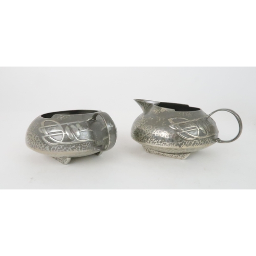 423 - ARCHIBALD KNOX (1864-1933) FOR LIBERTY & CO ENGLISH PEWTER FOUR PIECE TEA SET ON TRAYcomprising ... 