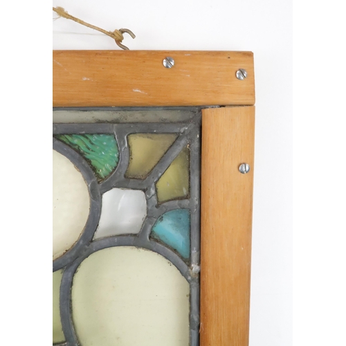 427 - A STAINED AND LEADED GLASS PANELdepicting Gorbals Chapel, Glasgow, in wooden frame, 77cm x 54cm... 