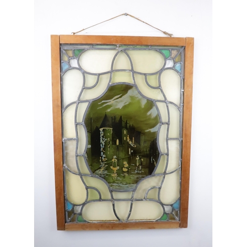 427 - A STAINED AND LEADED GLASS PANELdepicting Gorbals Chapel, Glasgow, in wooden frame, 77cm x 54cm... 