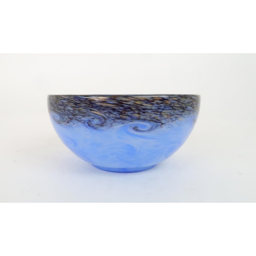 428 - A MONART BLUE GLASS BOWLwith mottled purple and gold aventurine rim and swirling design, shape numbe... 