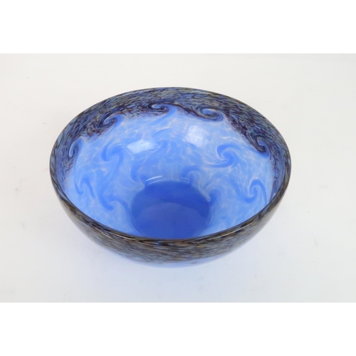 428 - A MONART BLUE GLASS BOWLwith mottled purple and gold aventurine rim and swirling design, shape numbe... 