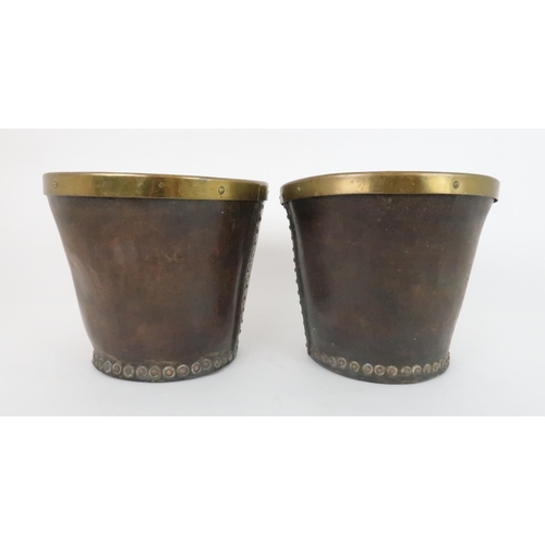 551 - A PAIR OF VICTORIAN LEATHER AND BRASS BOUND BUCKETS with stud work, 23cm high x 26cm wide... 