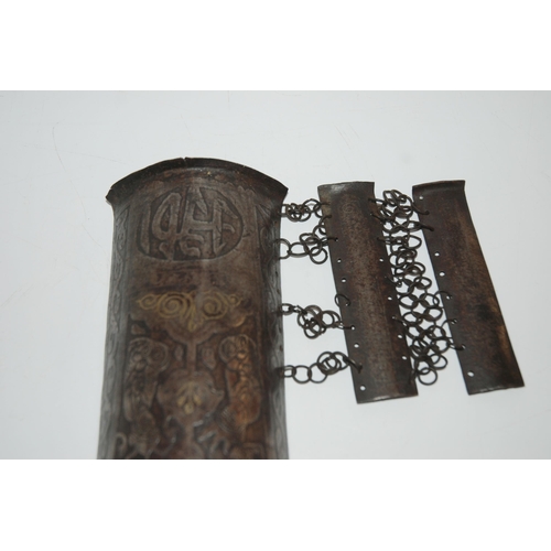 552 - A MIDDLE-EASTERN IRON ARM GUARD BAZU BAND decorated with figures, with wrist guard, 32cm long... 