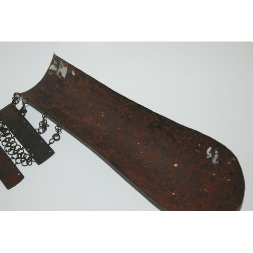 552 - A MIDDLE-EASTERN IRON ARM GUARD BAZU BAND decorated with figures, with wrist guard, 32cm long... 