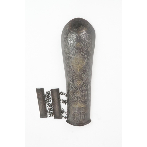 552 - A MIDDLE-EASTERN IRON ARM GUARD BAZU BAND decorated with figures, with wrist guard, 32cm long... 