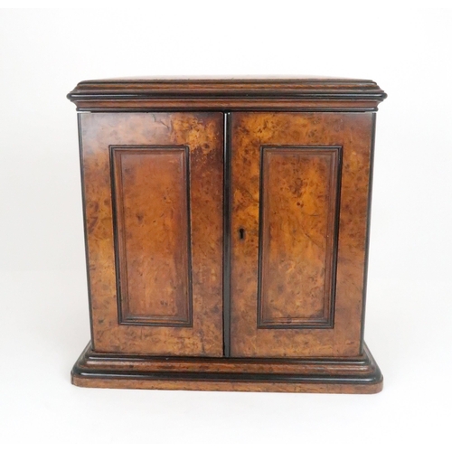 554 - A VICTORIAN BURR WALNUT THREE DRAWER COLLECTORS/TABLE CABINET with hinged doors and brass inset draw... 