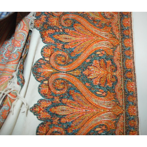 557 - A VICTORIAN WHITE GROUND PAISLEY SHAWL250 x 155cm